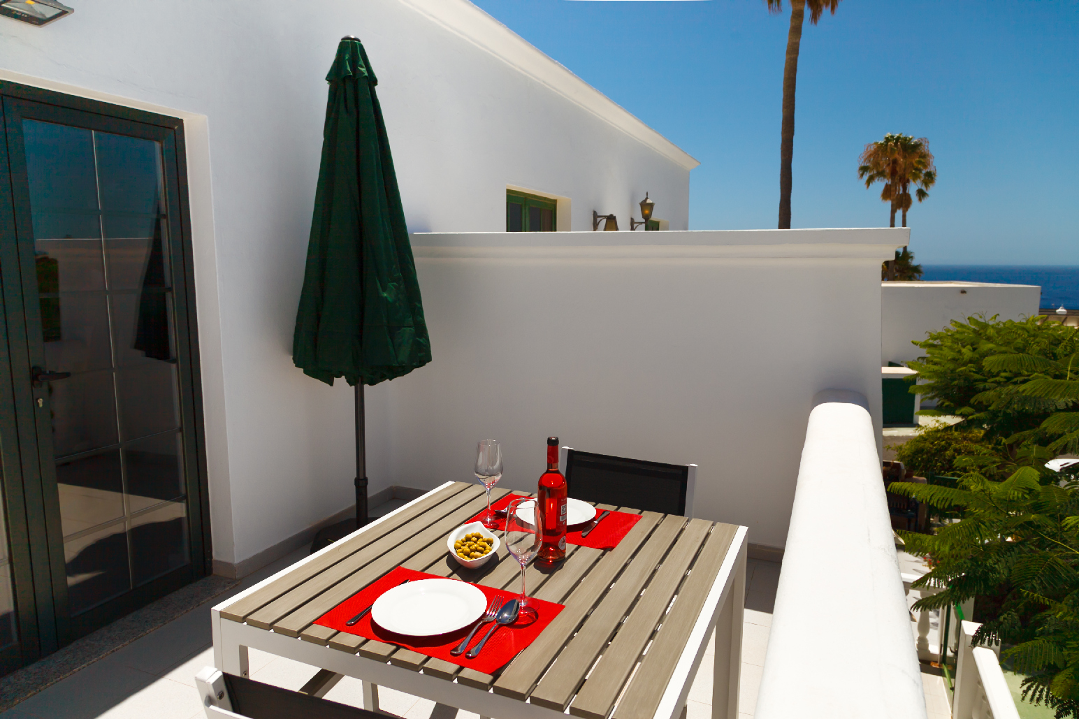 Private terrace at Loma Verde holiday apartment with sea view and outdoor table