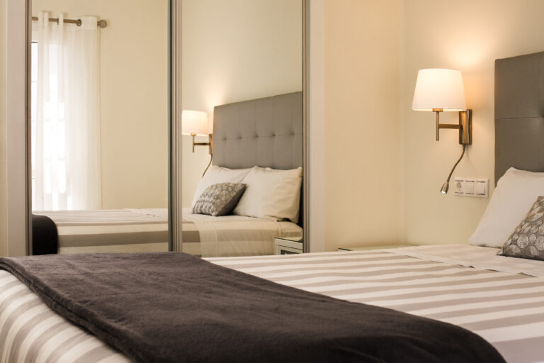 San Fermín bedroom with mirror and soft lighting in Puerto del Carmen