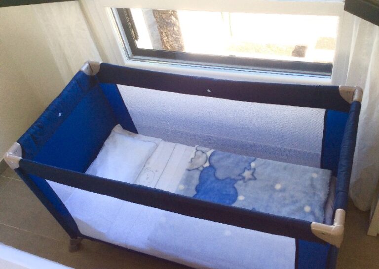 Baby cot available on request at San Fermín holiday apartment
